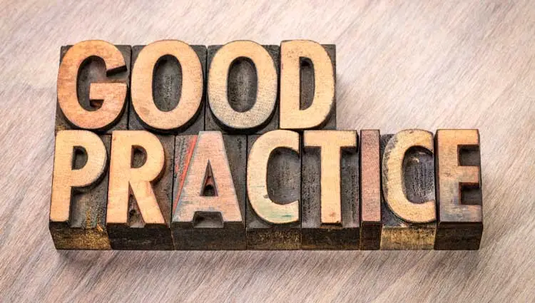 An image of a wood sign saying good practice referring to good habits making a good year.