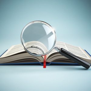 magnifying glass over open book depicting micro lessons